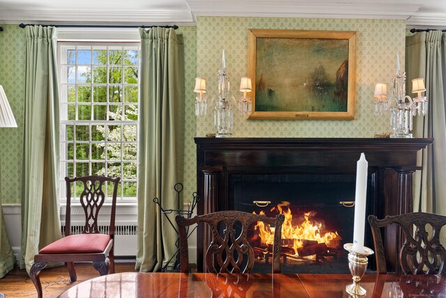 interior space with crown molding, radiator, and wood-type flooring