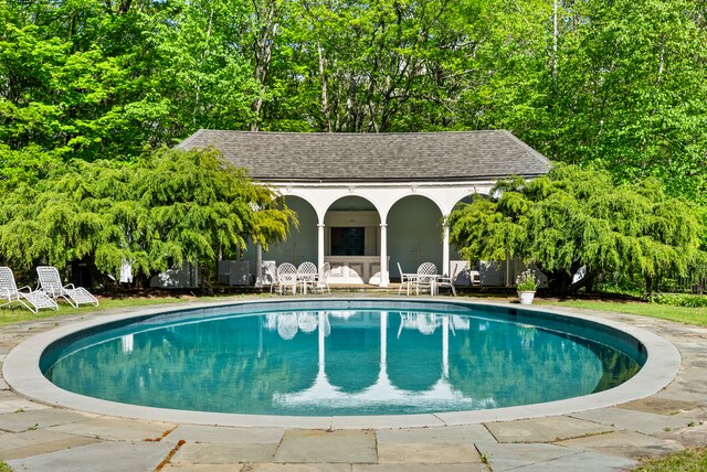 view of pool featuring a patio