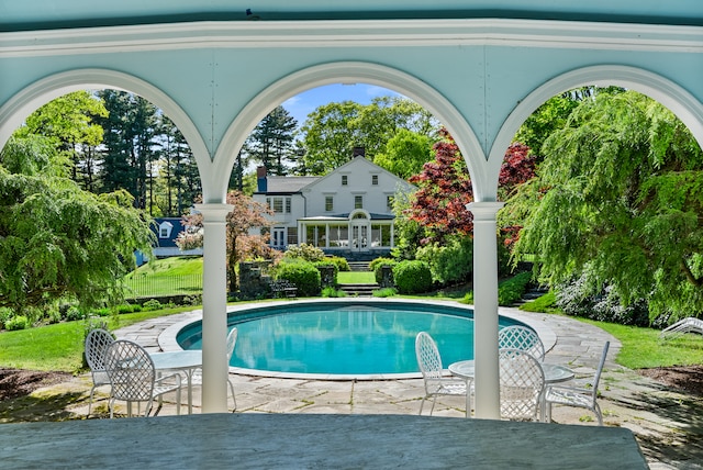 view of pool featuring a patio