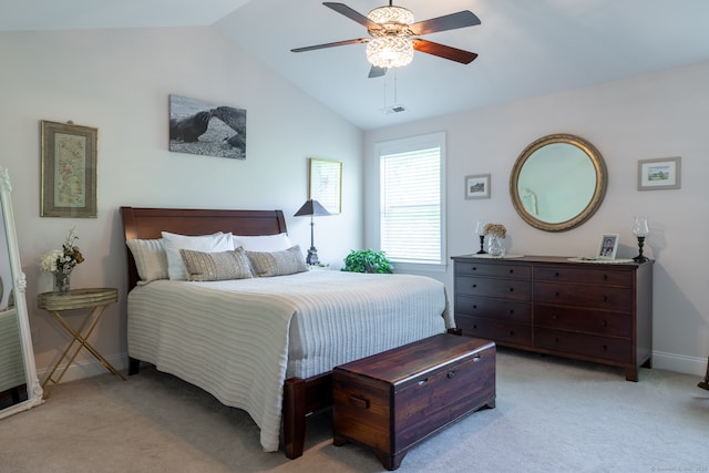 carpeted bedroom with lofted ceiling and ceiling fan