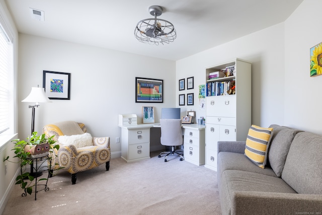 office space with light colored carpet