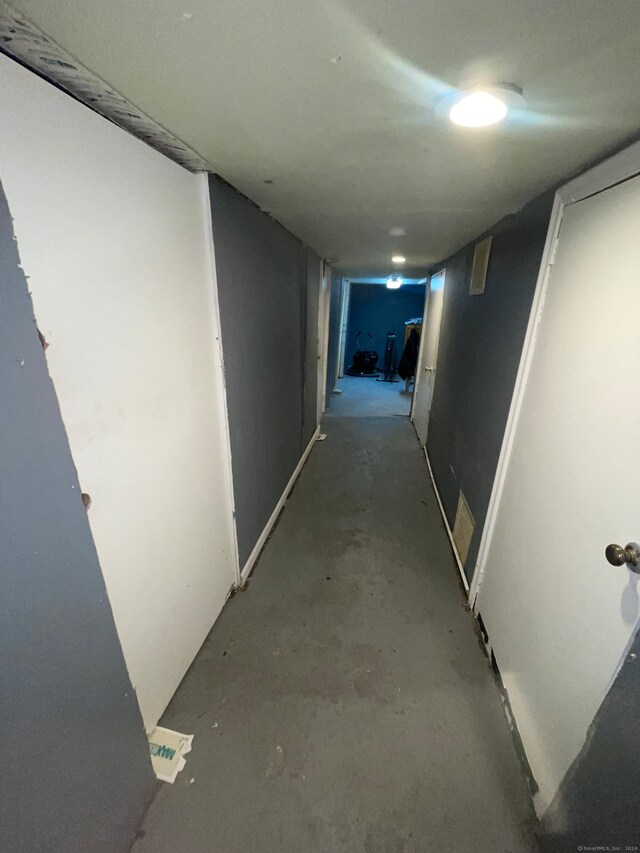 hallway featuring concrete flooring