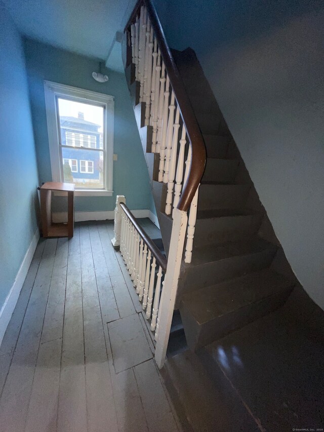 staircase featuring hardwood / wood-style flooring