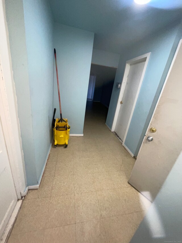 hallway featuring tile floors