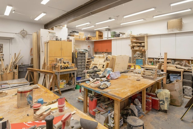 interior space featuring a workshop area and concrete floors