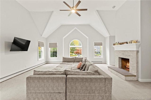 carpeted living room featuring a fireplace, a baseboard radiator, lofted ceiling, and ceiling fan