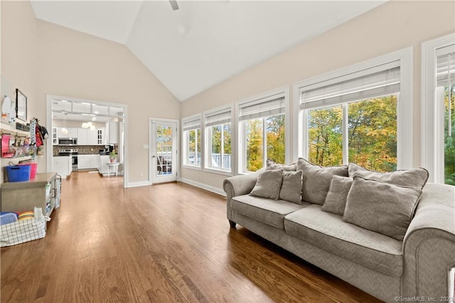 sunroom featuring vaulted ceiling