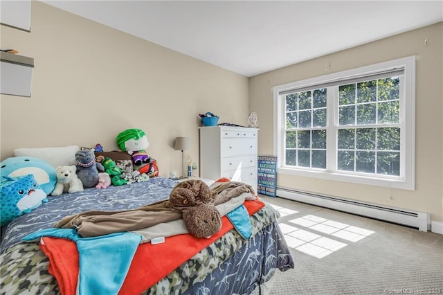 bedroom featuring a baseboard heating unit and carpet floors