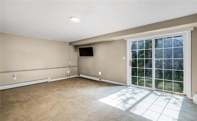 carpeted spare room with a baseboard radiator