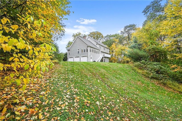 view of yard with a garage