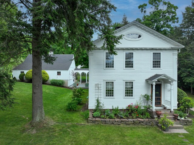 view of front of property with a front lawn