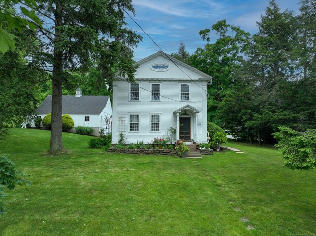 view of front of house with a front lawn