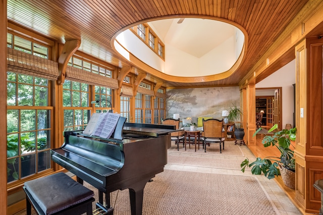 misc room featuring light tile patterned flooring and wood ceiling