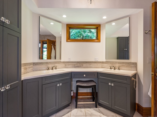 bathroom with plenty of natural light and vanity