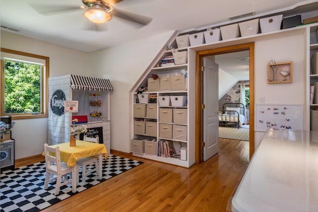 interior space featuring hardwood / wood-style flooring and ceiling fan