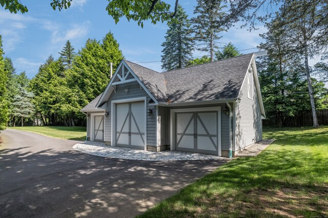 garage featuring a lawn