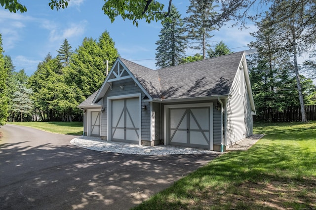 garage featuring a yard