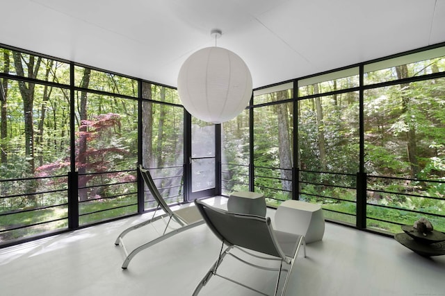 unfurnished sunroom with plenty of natural light