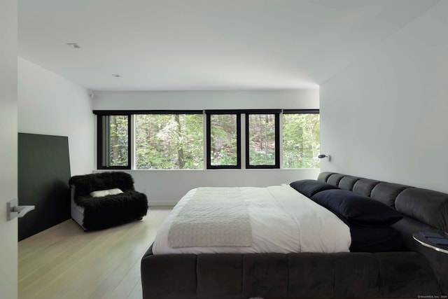 bedroom with light hardwood / wood-style floors