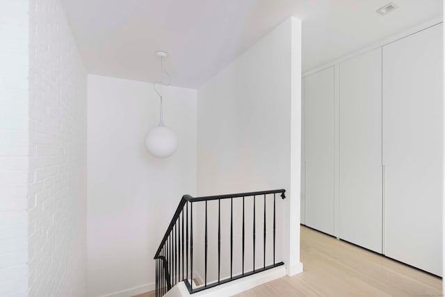 corridor featuring light hardwood / wood-style floors