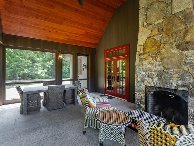 view of patio / terrace with french doors and a fireplace