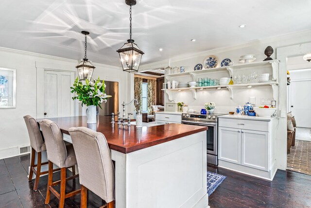 402 Perrin Rd, Woodstock, CT 06281 - kitchen featuring stainless steel electric range oven, wooden counters, a sink, an island with sink, and white cabinets