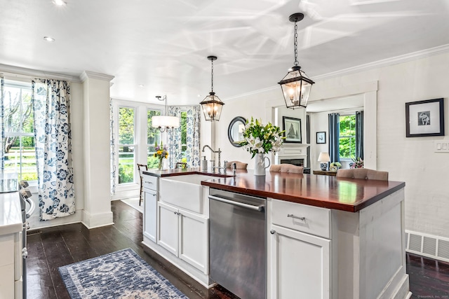 402 Perrin Rd, Woodstock, CT 06281 - kitchen featuring butcher block countertops, dishwasher, a sink, plenty of natural light, and crown molding