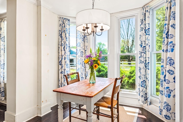 402 Perrin Rd, Woodstock, CT 06281 - dining area featuring baseboards, dark wood-style floors, a chandelier, and ornamental molding