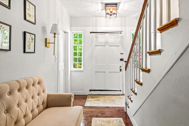 402 Perrin Rd, Woodstock, CT 06281 - foyer with dark wood-style floors and stairway