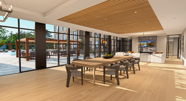 dining room with light hardwood / wood-style floors, an inviting chandelier, a wall of windows, and wooden ceiling