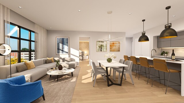 living room with sink and light hardwood / wood-style floors