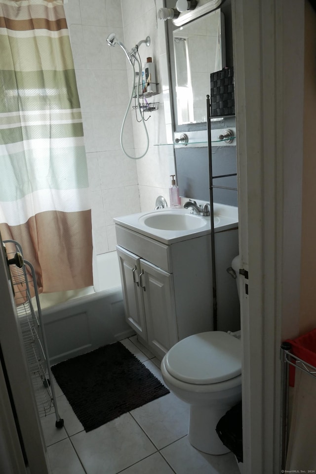 full bathroom with toilet, shower / bathtub combination with curtain, vanity, and tile patterned flooring