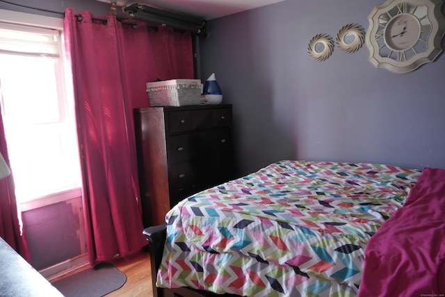 bedroom with light wood-type flooring