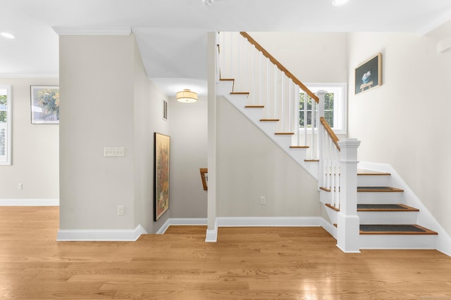 30 Village Xing Unit 30, East Lyme, CT 06357 - staircase with plenty of natural light, wood finished floors, crown molding, and recessed lighting