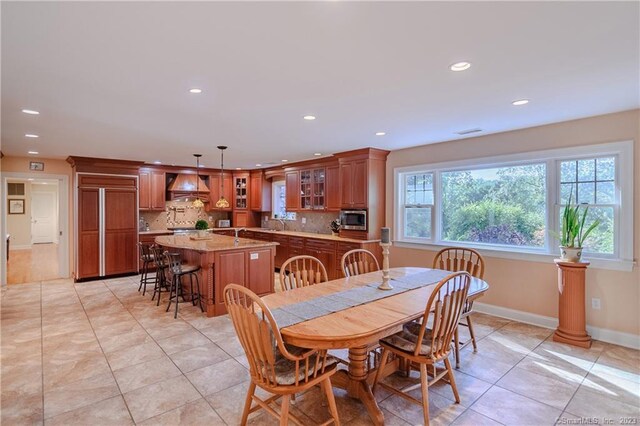 dining room with light tile patterned flooring