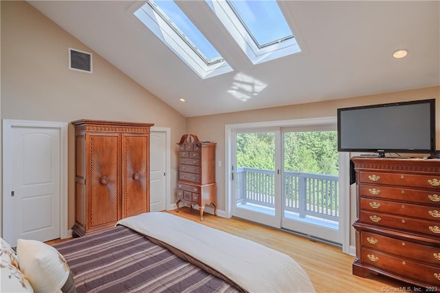 bedroom featuring access to exterior, lofted ceiling, and light wood-type flooring