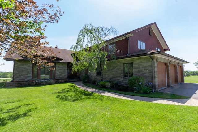 exterior space with a garage and a yard