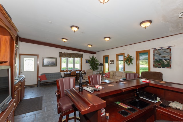 dining room with dark tile flooring