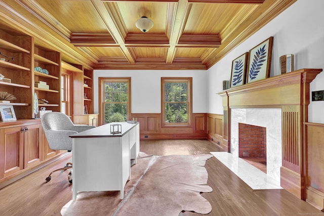 home office with wood ceiling, crown molding, light wood-type flooring, beamed ceiling, and a high end fireplace