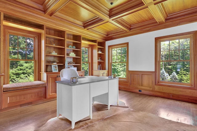 unfurnished office with coffered ceiling, crown molding, wooden ceiling, and light hardwood / wood-style floors