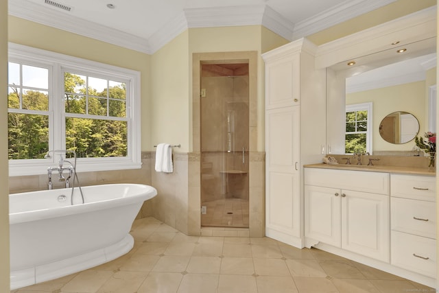 bathroom with crown molding, vanity, shower with separate bathtub, and a wealth of natural light