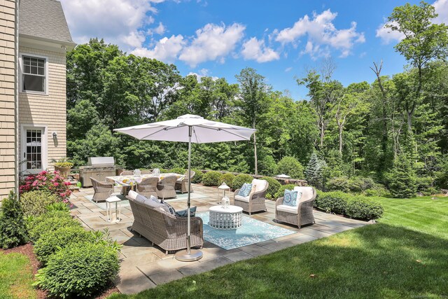 view of patio / terrace featuring exterior kitchen and an outdoor hangout area