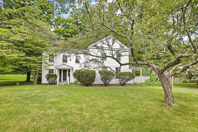 view of front of property with a front lawn