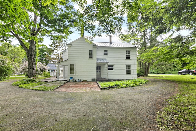 rear view of house with a patio