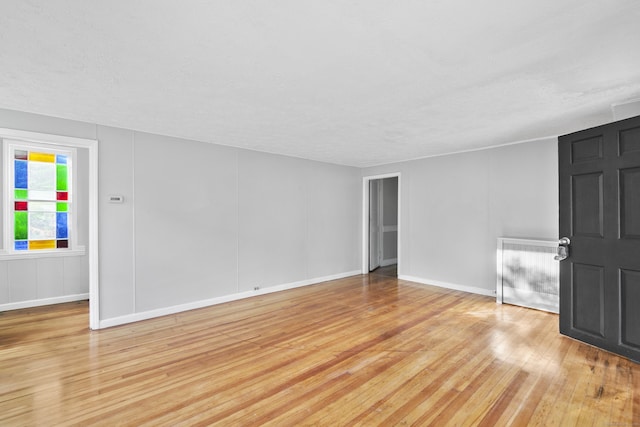 unfurnished room featuring light wood-type flooring