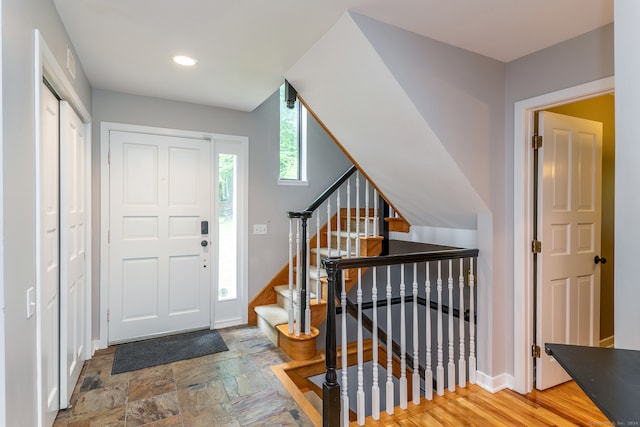 entryway with hardwood / wood-style flooring