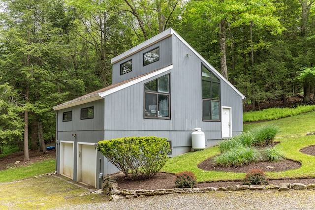 view of side of property featuring a garage