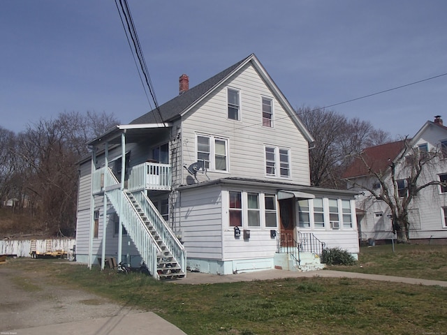 front facade with a front yard