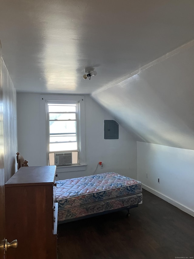 bedroom featuring cooling unit, lofted ceiling, and dark hardwood / wood-style floors