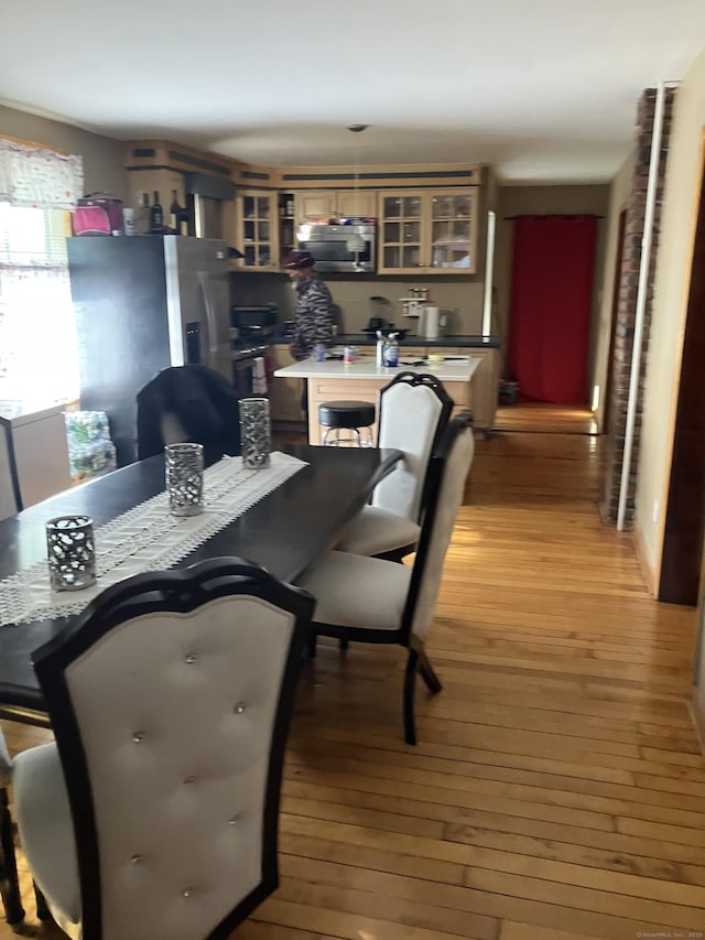 dining room with light hardwood / wood-style floors